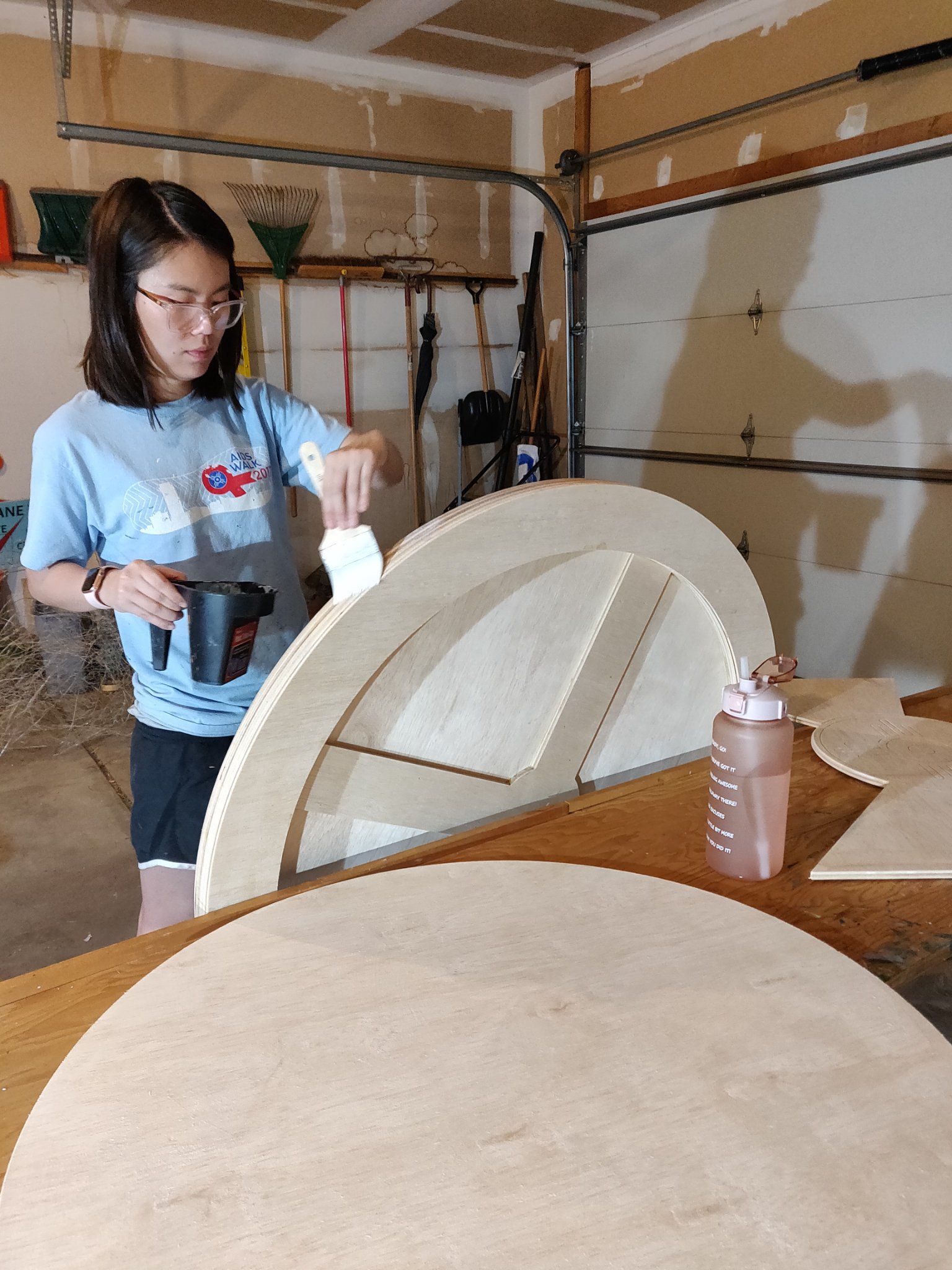 Portfolio | Sarah Myose — Art & Marketing Work Priming wood pieces for the Old Mill Front Porch