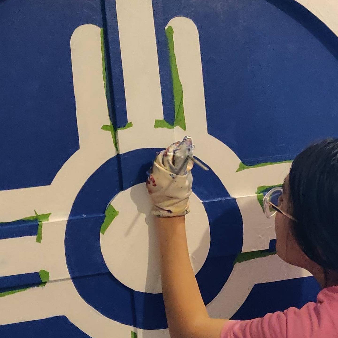 Portfolio | Sarah Myose — Art & Marketing Work Painting the Wichita flag circle for the Front Porch