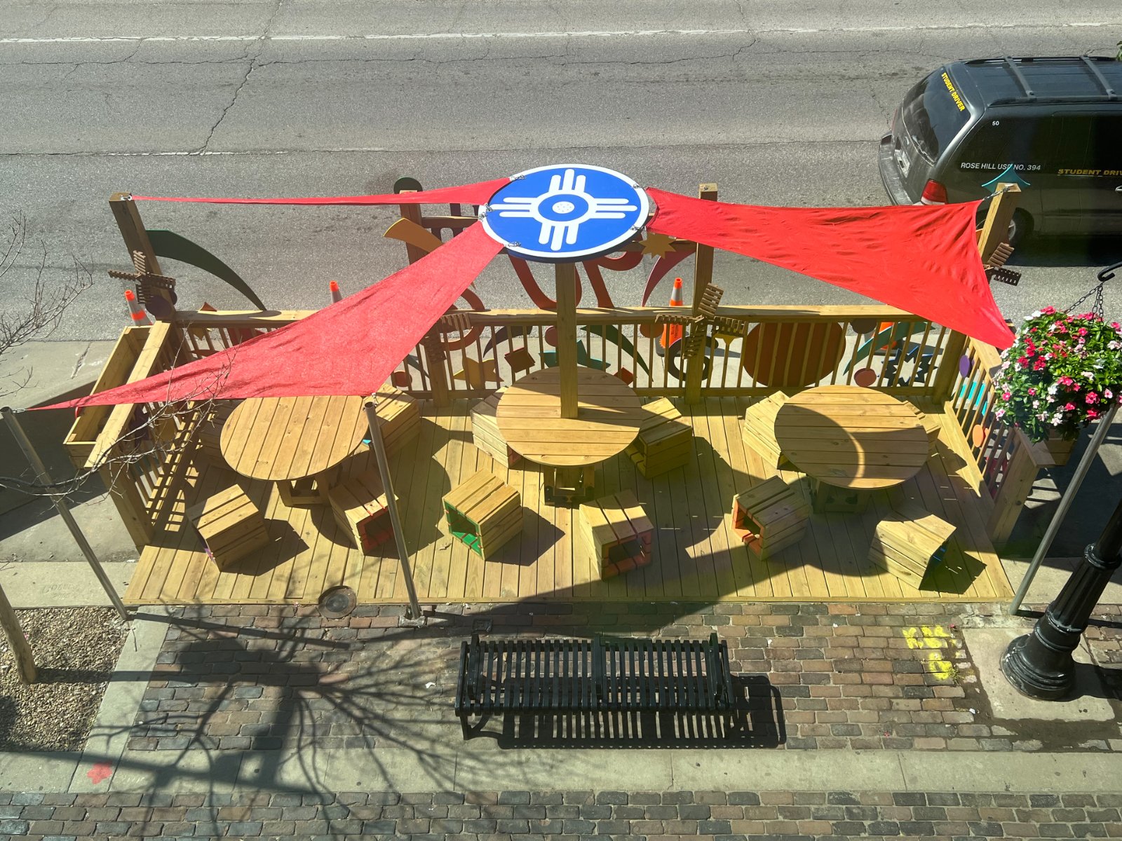 Portfolio | Sarah Myose — Art & Marketing Work Front Porch sail shade structure emulating the Wichita flag