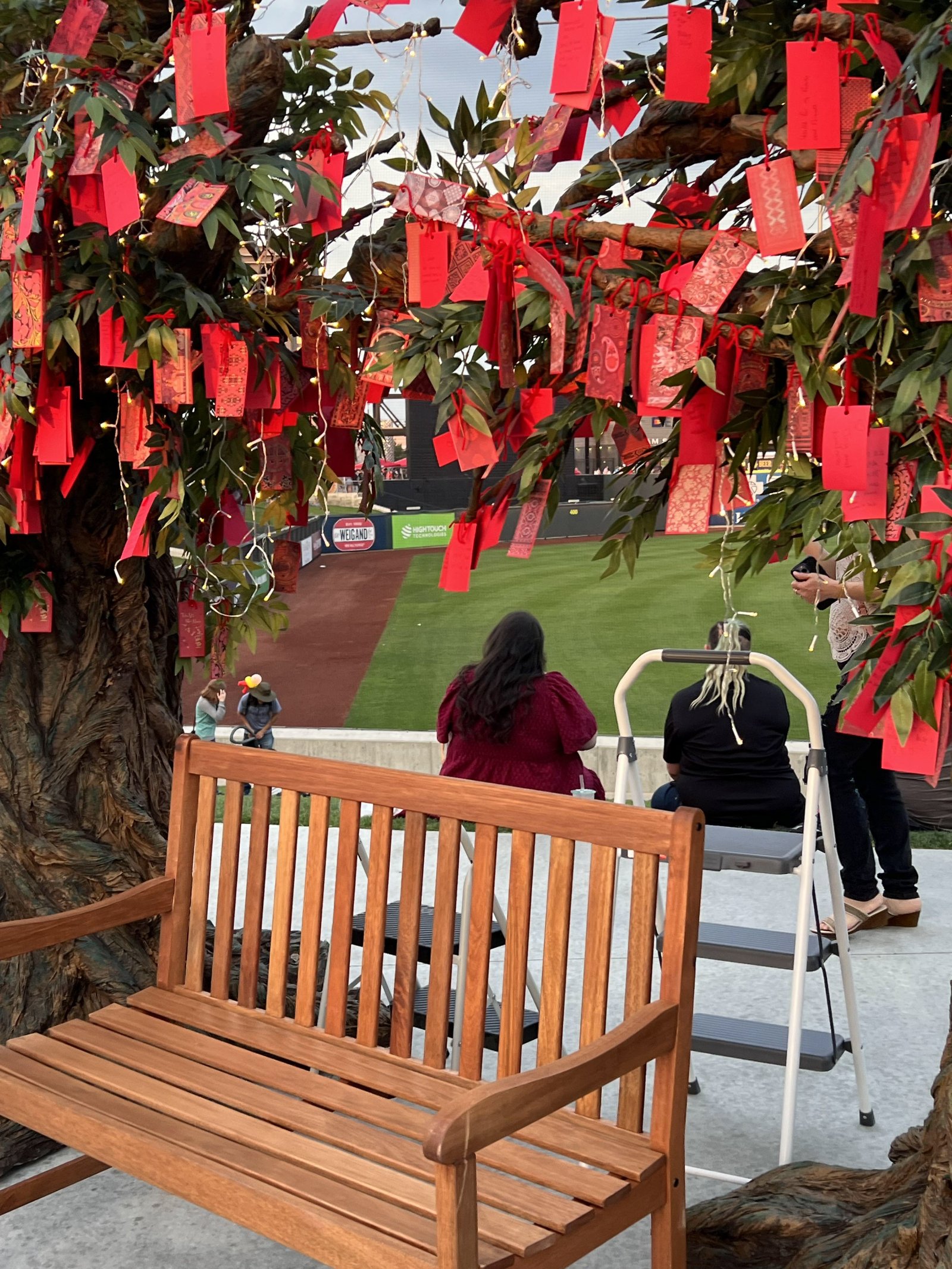 Portfolio | Sarah Myose — Art & Marketing Work Visitors interacting with the Wish Trees installation